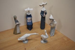 A group of six Lladro porcelain figurines and bird studies, comprising two nun figurines 5550 &