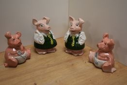 A group of four Wade Natwest piggy money banks, comprising two Woody and two Annabel, each with