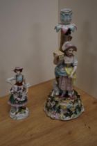 A Sitzendorf porcelain figural candlestick, formed as a young girl stood aside a lamb and tree