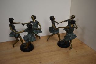 A pair of Maitland-Smith cast, painted and patinated brass sculptures, formed as a linked group of