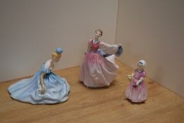 A group of three Royal Doulton bone china figurines, comprising 'Gay Morning' HN2135 designed by