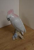 A mid-century Royal Dux porcelain ornithological study of a pink crested cockatoo, modelled