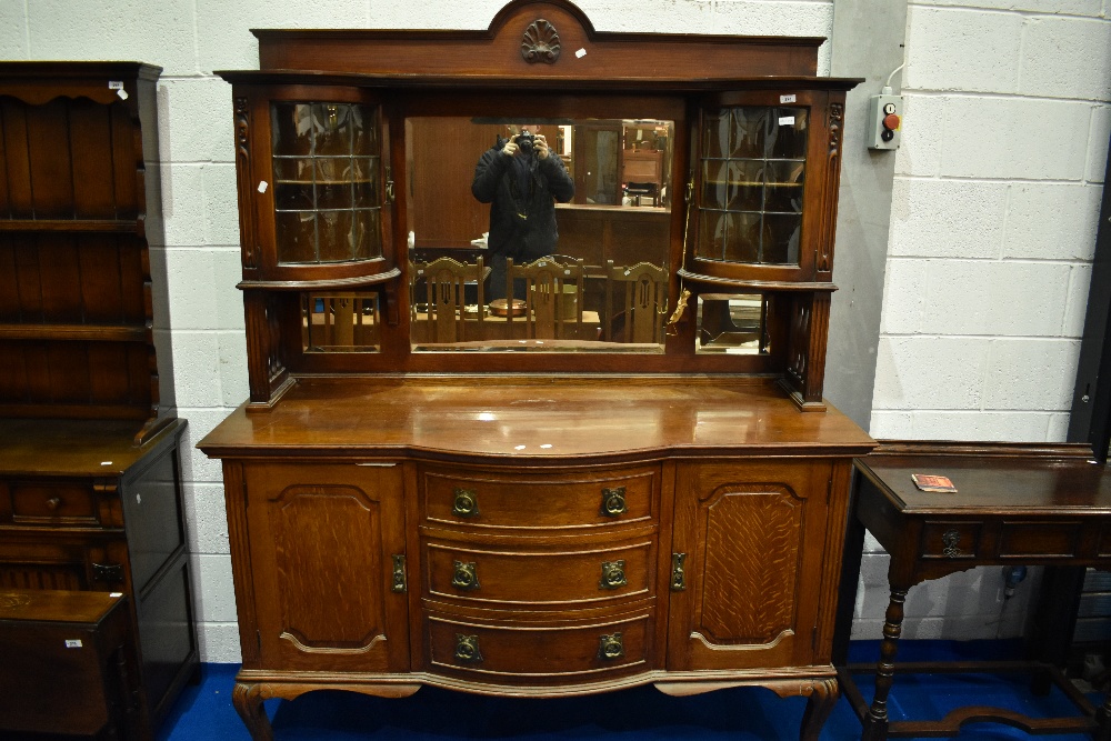 A late Victorian oak mirror back sideboard , with Art Nouveau style brass handles