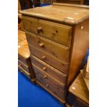 A modern pine tall chest of six drawers, approx. dimensions H107 W59 D46cm