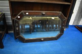An early 20th Century Jacobean style oak canted wall mirror, approx 83 x 53cm