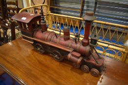 A modern locomotive train model, metal and wood construction