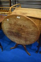 A 19th Century oak snaptop occasional table having circular top, turned column and triple splay