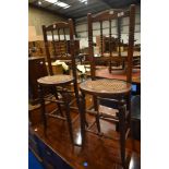 A pair of Victorian mahogany correction chairs having turned frame and cane seats