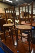 A pair of Victorian mahogany correction chairs having turned frame and cane seats