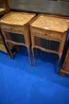 A pair of reproduction Louis XIV style bedside tables with frieze drawer and faux book fronted