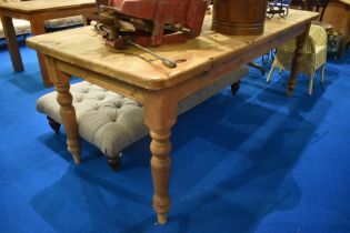 A traditional pine farmhouse kitchen table, on turned legs, approx dimensions. L220cm W89cm H79cm