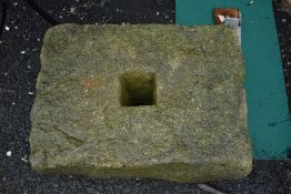 A large antique sandstone weight block