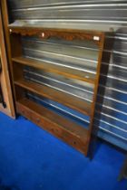 A traditional oak delft rack with lower drawer section