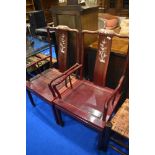 A pair of Oriental hardwood carver chairs having mother of pearl inlay decoration