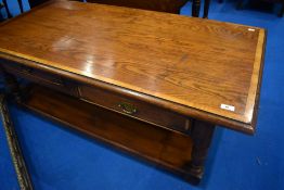 A good quality reproduction oak coffee table, approx 131 x 65cm