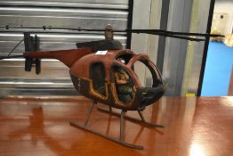 A modern decorative helicopter , wood and metal construction