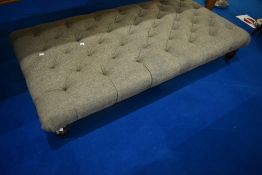 An oversized footstool or seat , finished in tweed upholstery, approx. Length 160cm, height 30cm