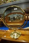 A vintage brass toilet mirror , height approx 43cm