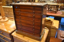 A 19th Century mahogany specimen cabinet , door removed but present, revealing eight drawers ,