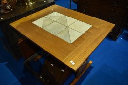 A vintage part teak extending dining table with tiles inset