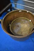 A vintage copper jam pan of large proportions and a similar smaller brass pan