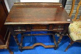 A late 19th or early 20th Century oak Jacobean style side table