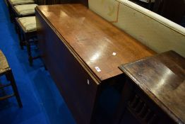 A Victorian oak drop leaf dining table on turned legs, approx width 112cm (open length approx.