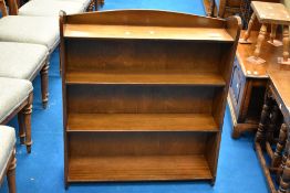 A vintage mahogany bookcase of stylised design, approx. width 77cm, height 90cm