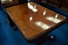 A 19th Century mahogany breakfast table, having gadrooned edge and scroll legs, approx. 142 x 96cm