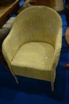 A vintage Lloyd Loom tub chair, in cream