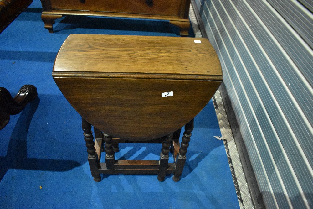 A traditional oak gateleg occasional table, approx width 55cm, open length 84cm, height 68cm
