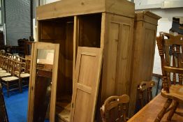 A natural pine sectional wardrobe, dimensions approx. H204 W150 D64cm