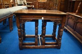A Titchmarsh and Goodwin reproduction oak nest of tables, top table approx 62 x 38cm