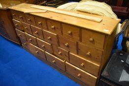 A modern pine merchants style chest/shop fitting, approx. Dimensions W168cm H90cm D32cm