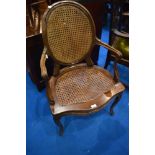 A French style carver chair having bergere cane seat and back panel