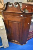 A 19th Century oak corner cupboard, approx dimensions. H136 W86 D51cm