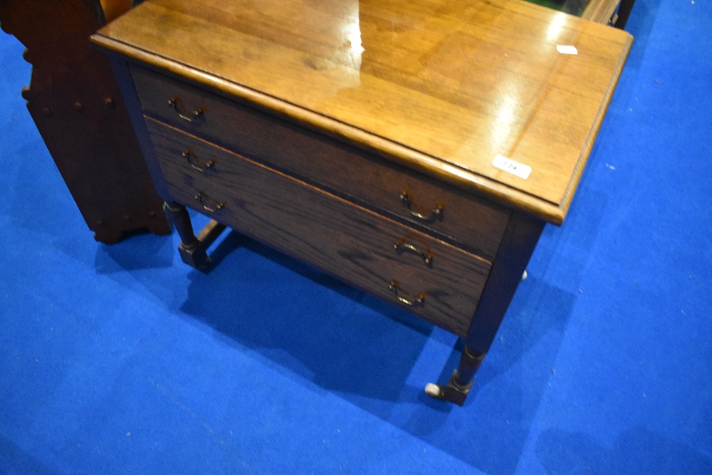 A traditional oak three drawer low chest on turned legs, width approx. 62cm, depth 39cm