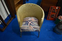 A vintage woven fibre tub chair