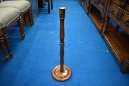 A turned oak candlestick, approx 62cm and a carved oak stool