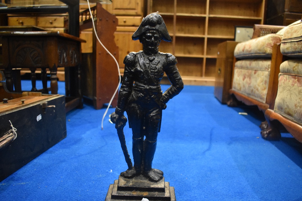 A vintage cast iron doorstop modelled as Nelson