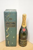 A bottle of Moet & Chandon Vintage 1992 Brut Imperial Champagne, 12.5% vol, 75cl, in tin