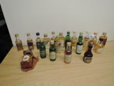 A collection of Single Malt Whisky Miniatures including The Macallan 10 Year Old, Bowmore 12 Year