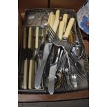 A collection of flatware including boxed butter knives and bone handled knives etc.