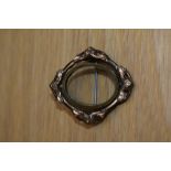 A Victorian swivel frame picture brooch in gold tone metal, with pin fastening.