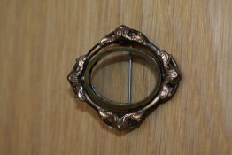 A Victorian swivel frame picture brooch in gold tone metal, with pin fastening.