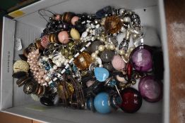 A box of miscellaneous costume jewellery, including polished stone necklaces, a shades of autumn