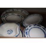 A selection of assorted blue and white serving plates, dishes and platters.