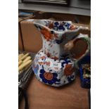 A large Masons Ironstone jug, having serpent handle and blue and rust foliate decoration.