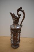 A 20th century chalk ware ewer with classical molded depictions.