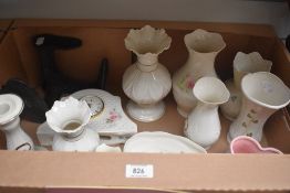A carton containing a selection of Belleek and Donegal china vases, posy pots, clocks and